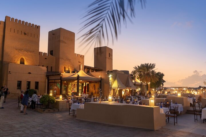 Experience a unique evening in the Dubai desert enjoying a luxurious banquet and engaging in traditional Arabian activities amidst stunning desert scenery and captivating entertainment.